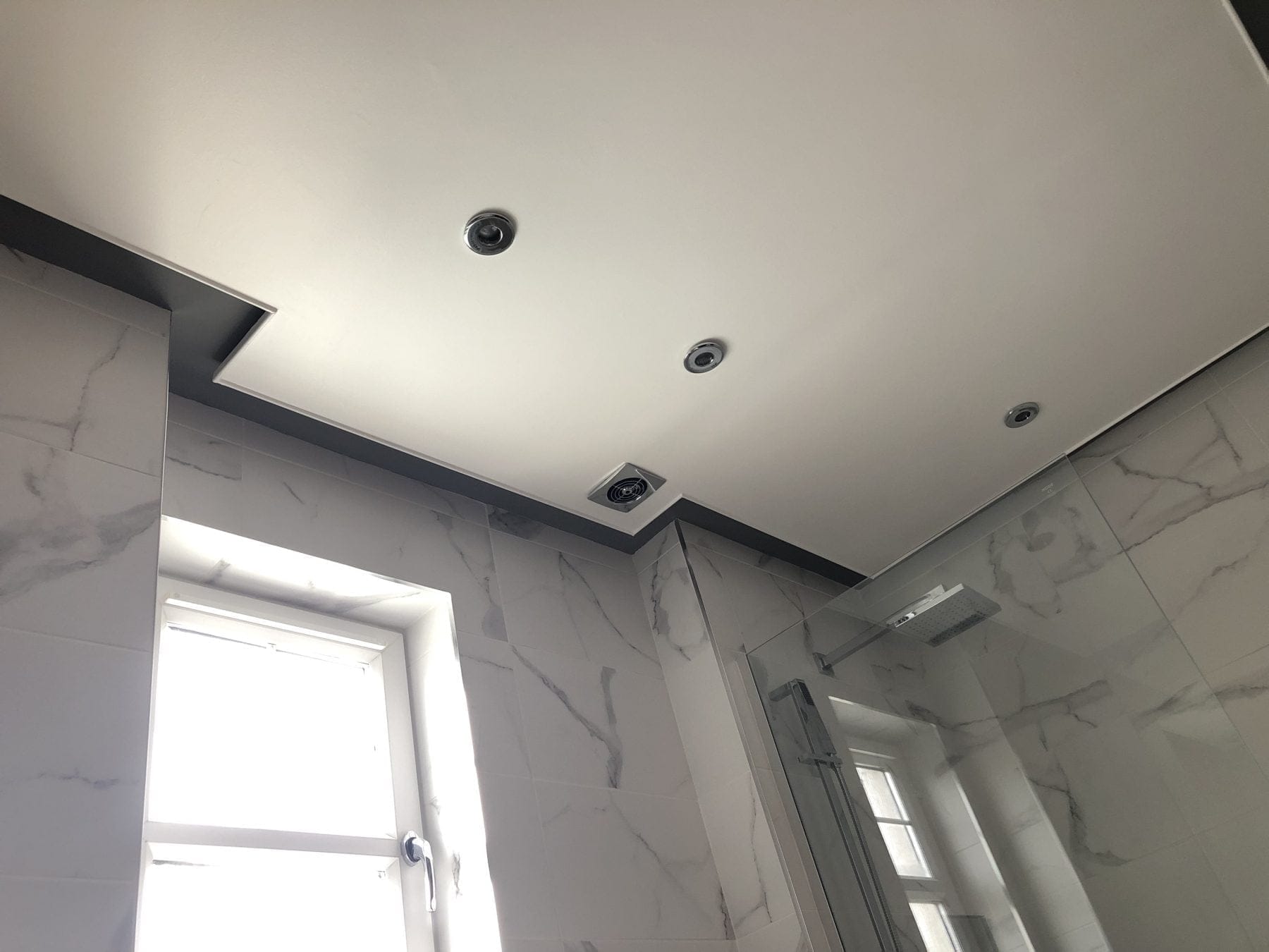 Completed bathroom ceiling by INSUREPAIR®